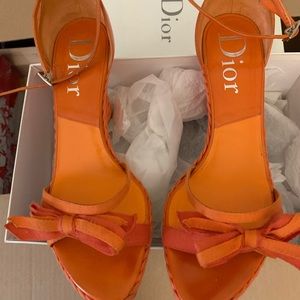 Dior Orange wedge heels.